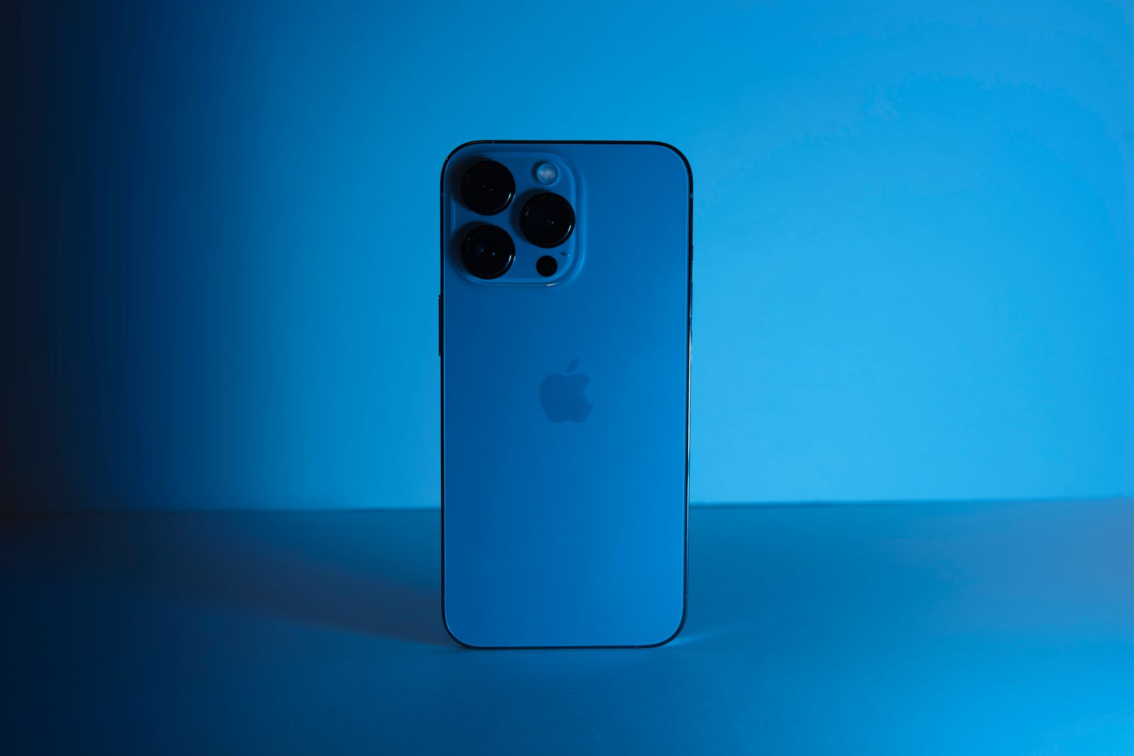 Modern blue smartphone photographed in a studio